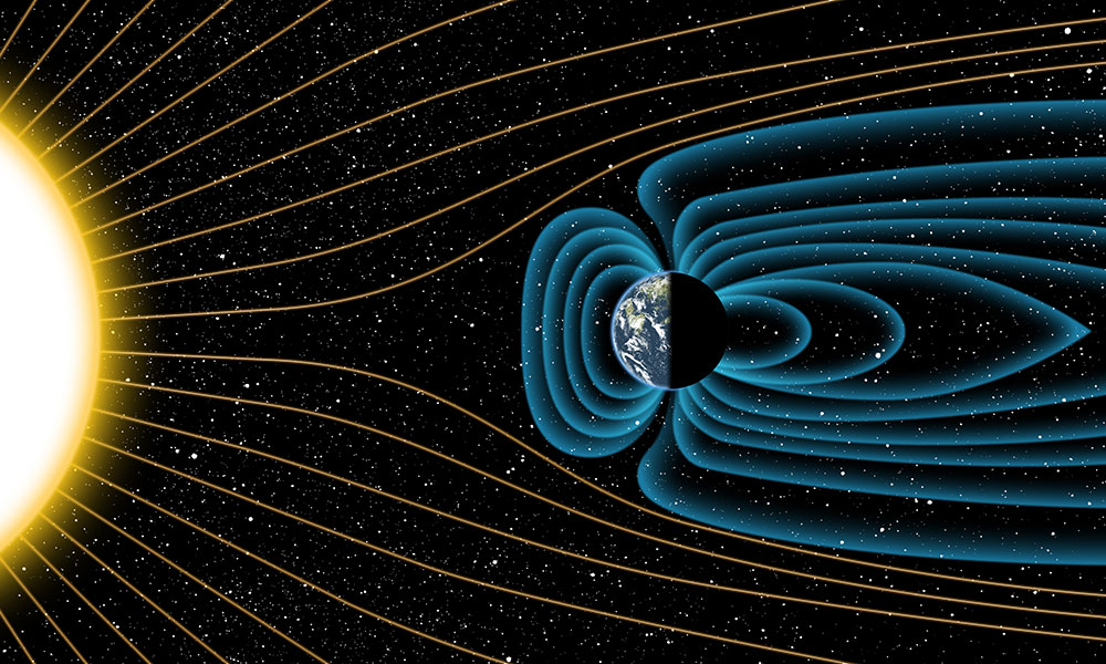 An artist’s depiction of Earth’s magnetic field deflecting high-energy protons from the sun four billion years ago. Note: The relative sizes of the Earth and Sun, as well as the distances between the two bodies, are not drawn to scale. (Graphic by Michael Osadciw/University of Rochester)