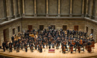 orchestra of African and Africa American musicians on Eastman Theatre stage