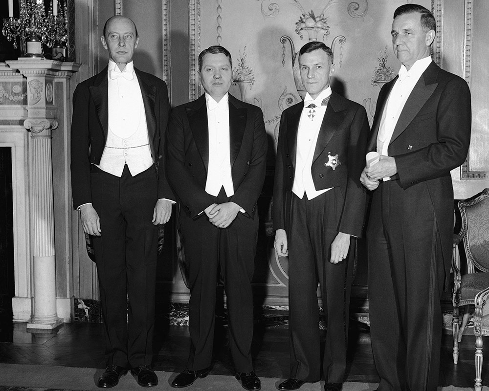four men in tuxedos