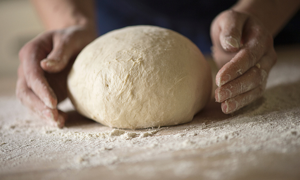 Close Up Of A Baker Kneading Bread Dough In A Metal Mixing Bowl High-Res  Stock Photo - Getty Images