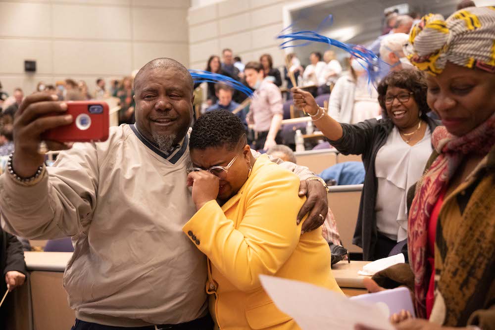 Man taking a selfie with his daughter, who is happily crying