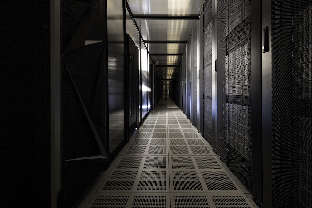 Long hallway with a grid-like floor housing a new supercomputer