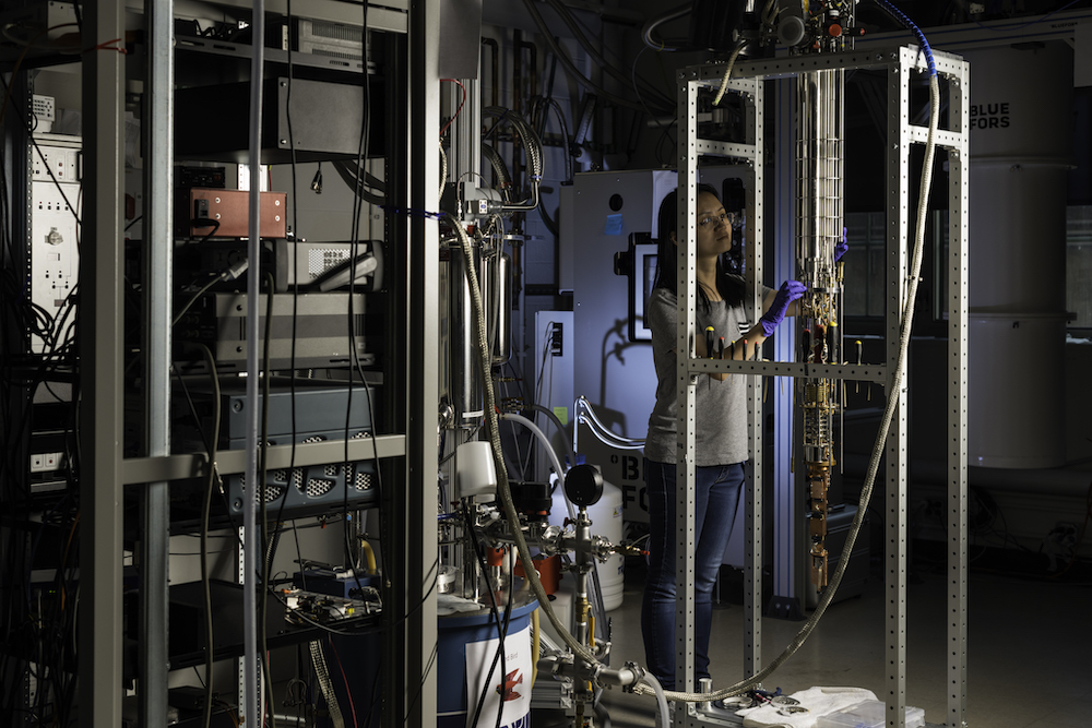 Female college student is pictured with a dilution refrigerator