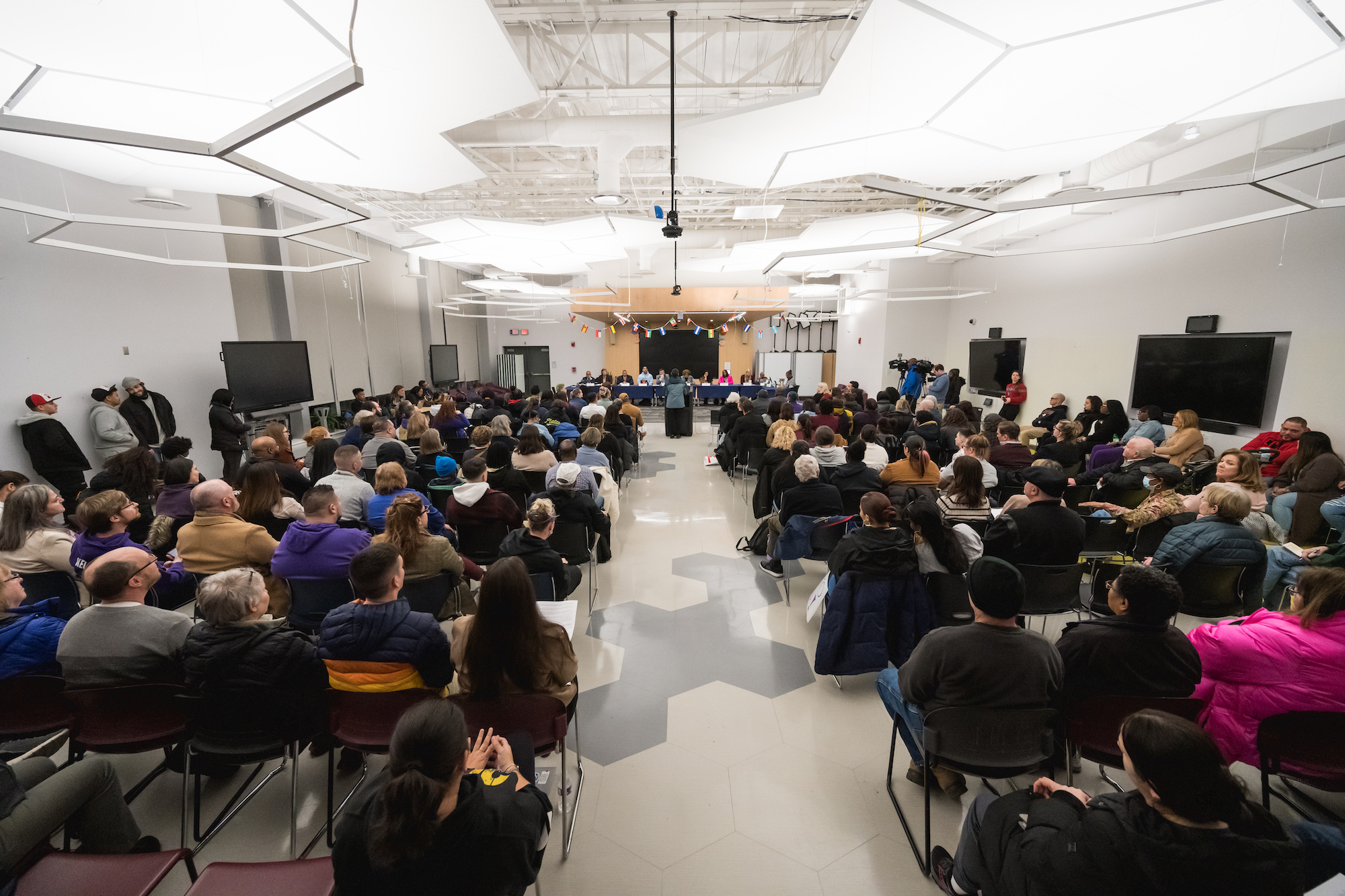 Students, parents, East staff and other community supporters attend a meeting 