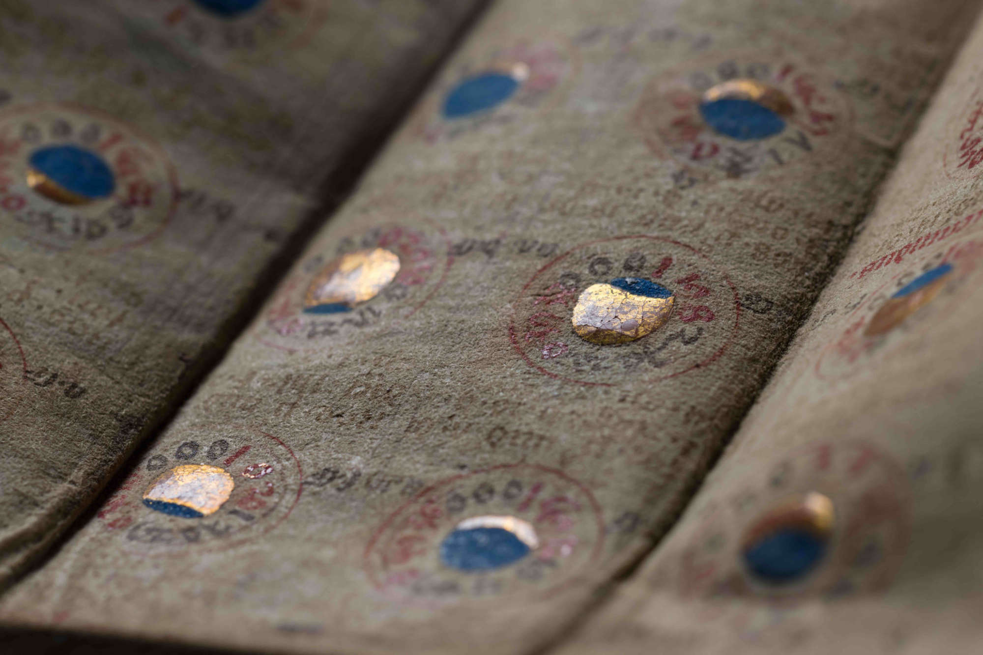 Close-up of the pages in the medieval "bat book almanac" depicting the lunar and solar eclipses.