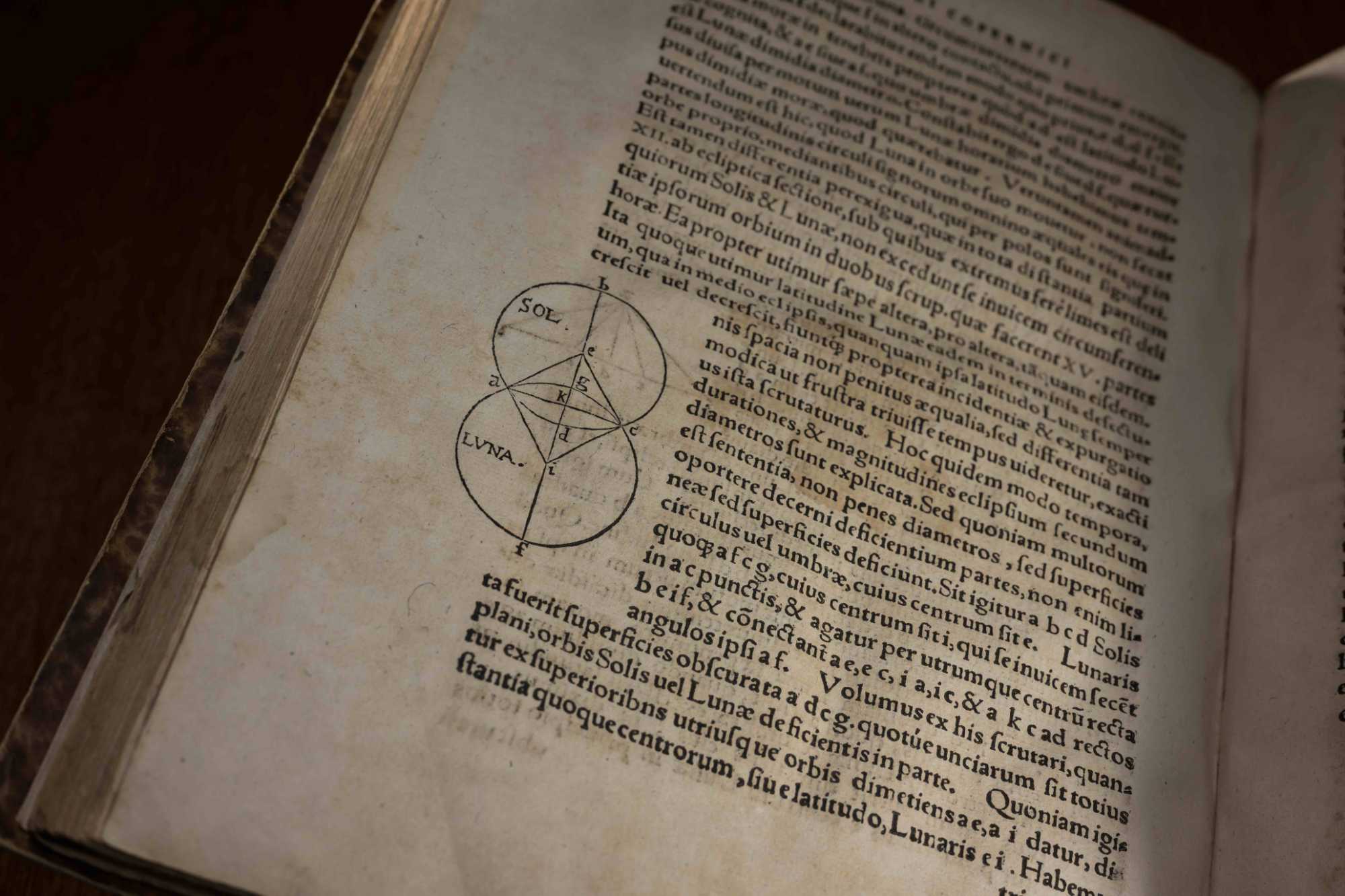 Close-up of a page from "De revolutionibus orbium coelestium" (English translation: On the Revolutions of the Heavenly Spheres) by Copernicus showing mathematical schematics of the relationship between the sun and the moon.