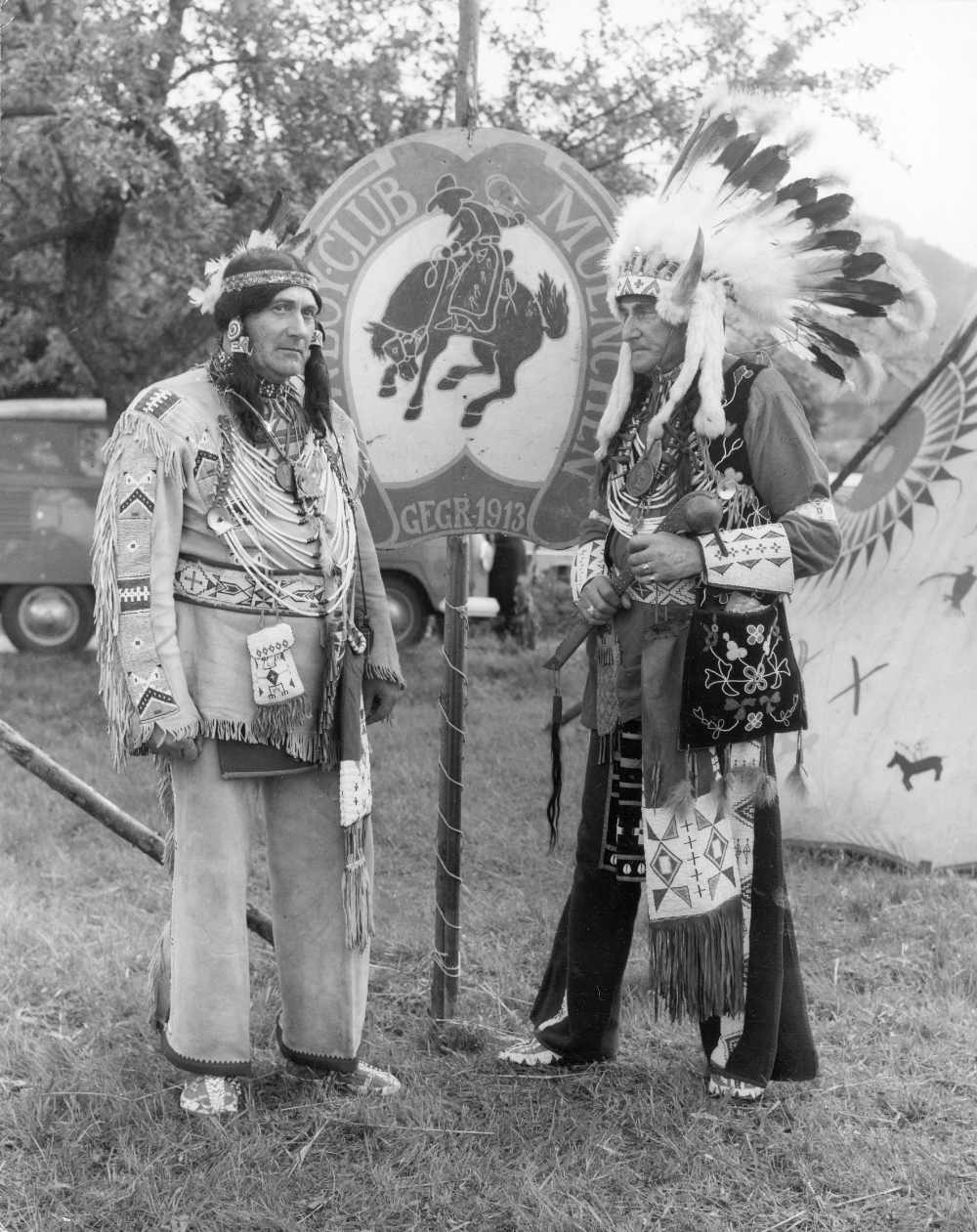 Archival image of two members of the Munich Cowboy Club dressed up in pseudo-Native American garb.