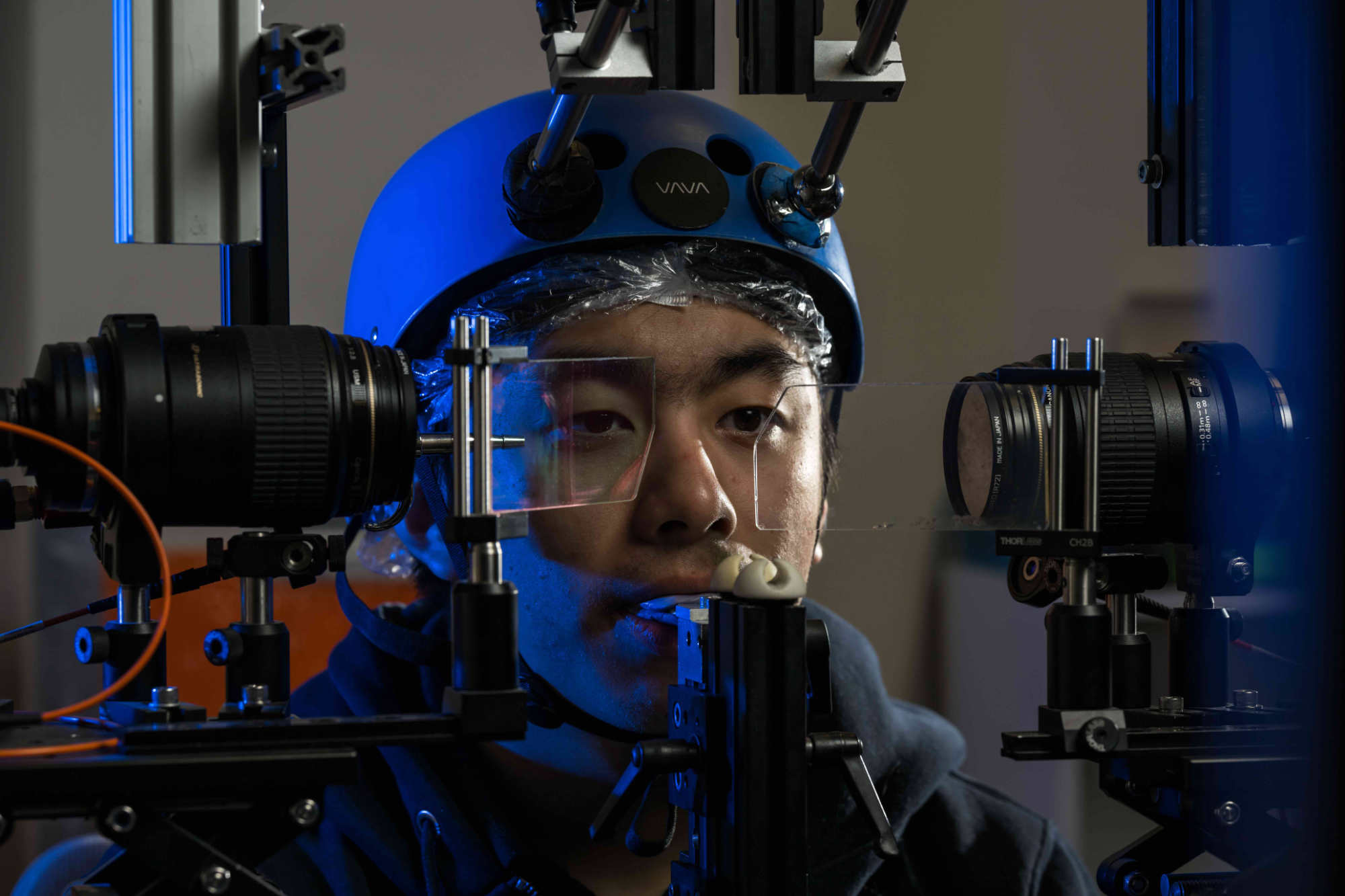 Person hooked up to an apparatus used to track eye movements to study why blinking is important.