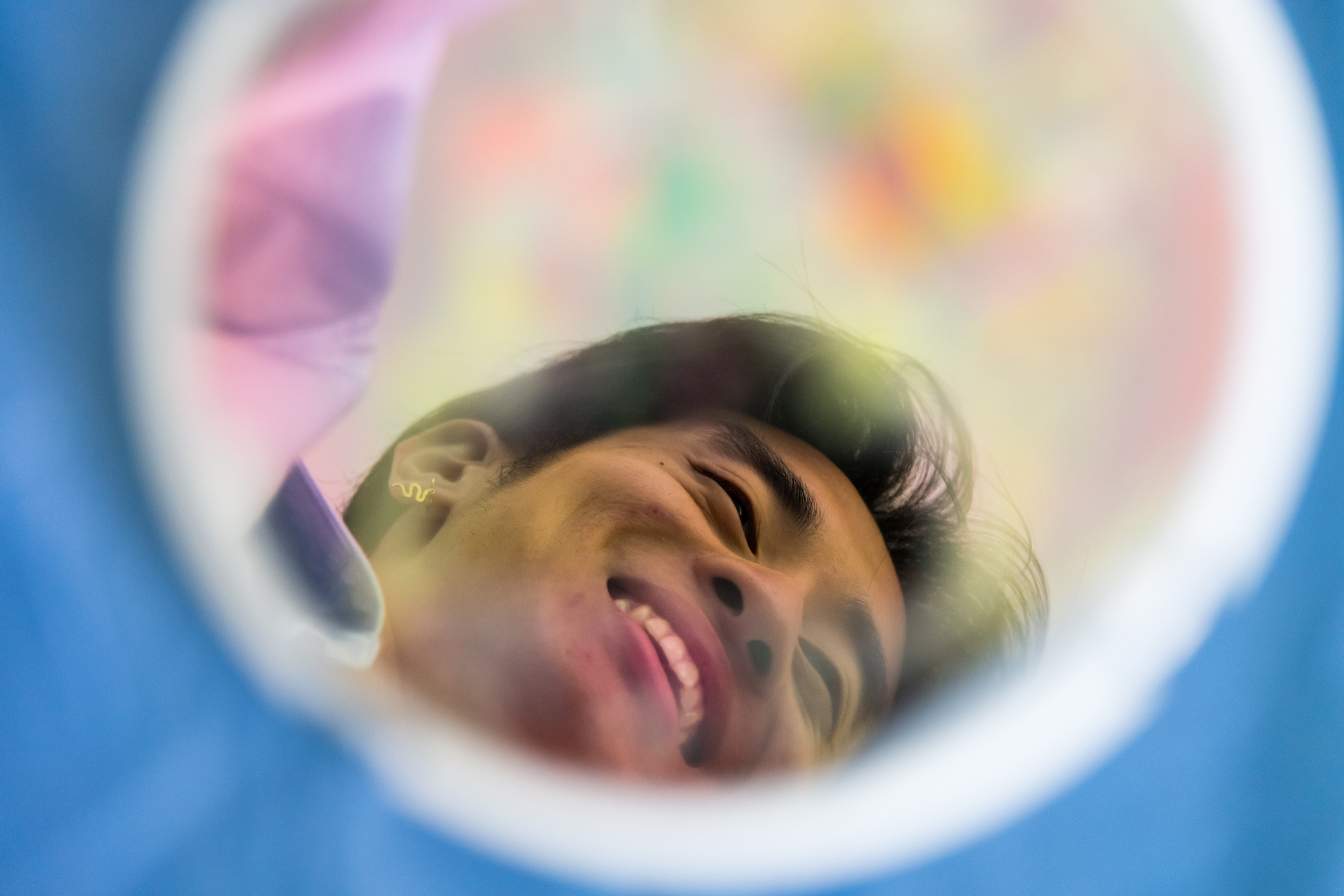Senior optics major Eric Li as seen through a round filter