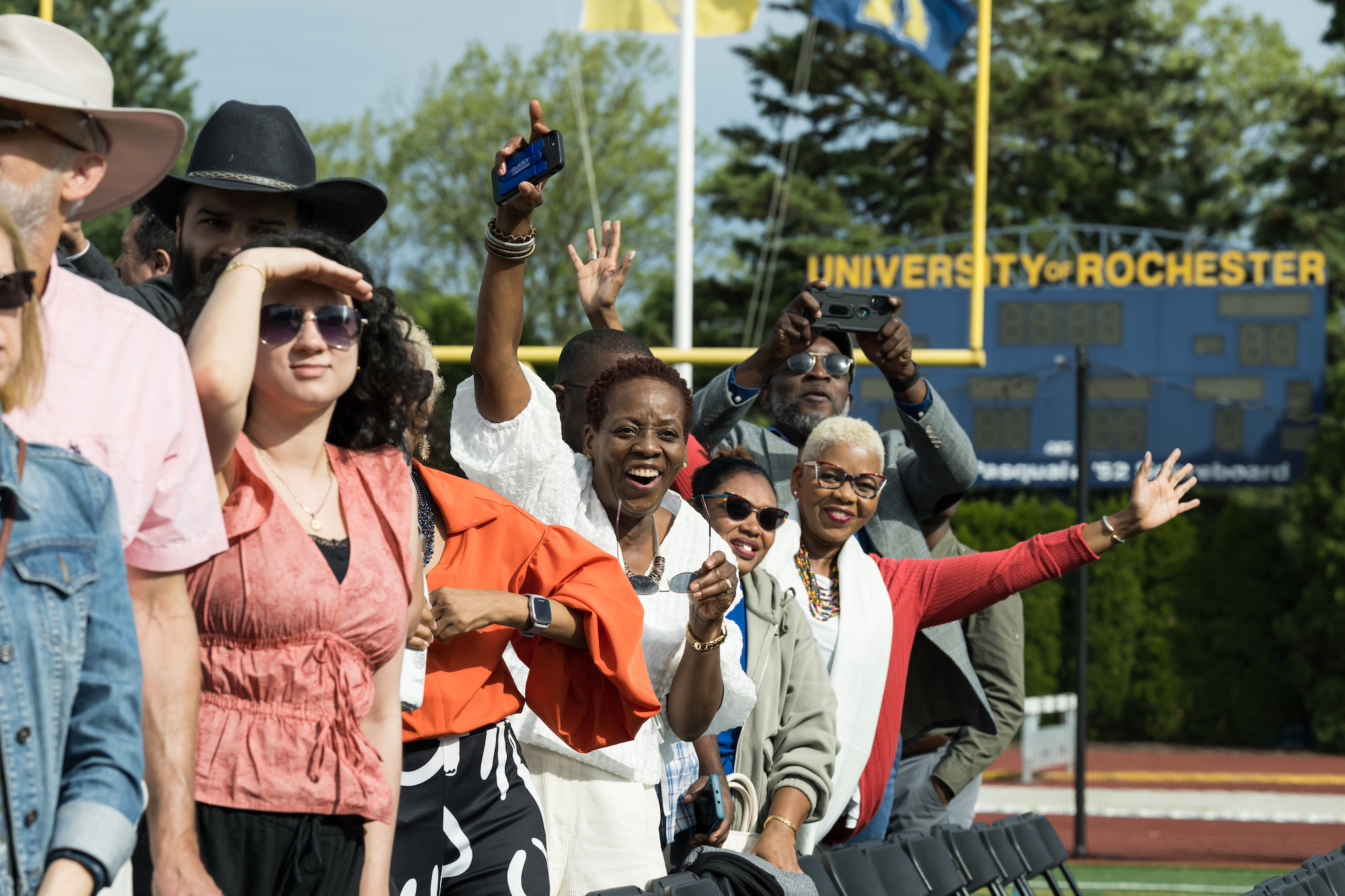 Several men and women cheering