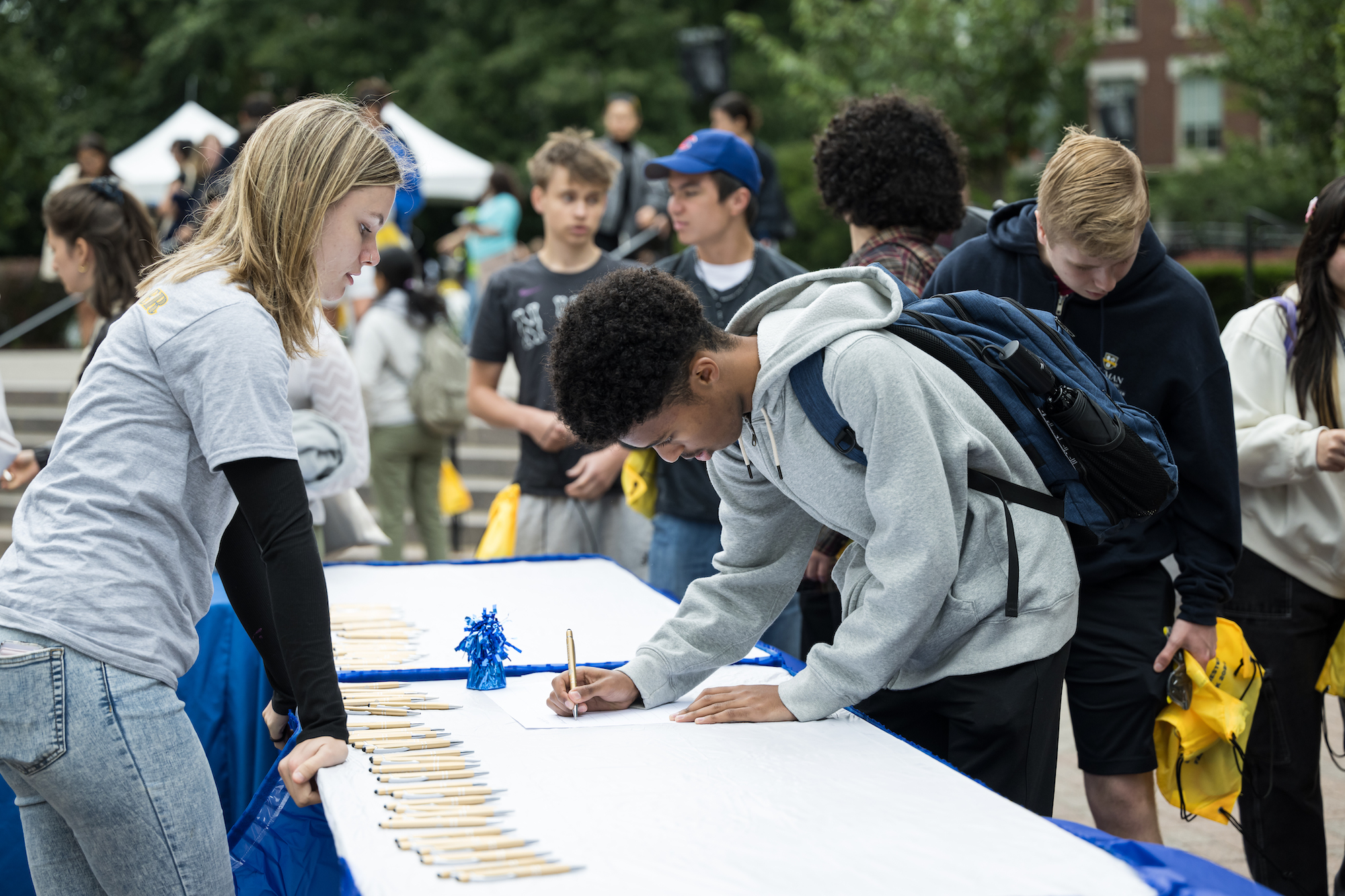 Students sign the class roll 