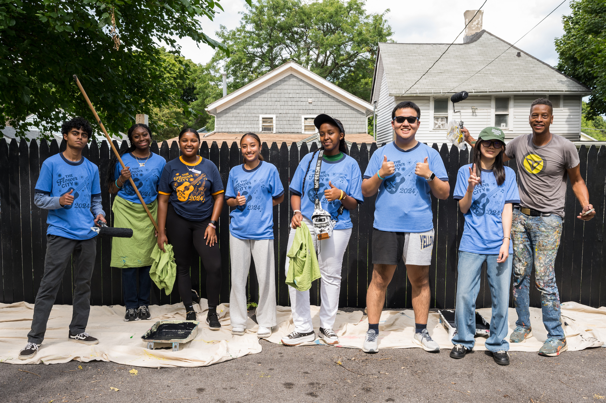 Rochester students and Shawn Dunwoody pose in Bohrer Alley 
