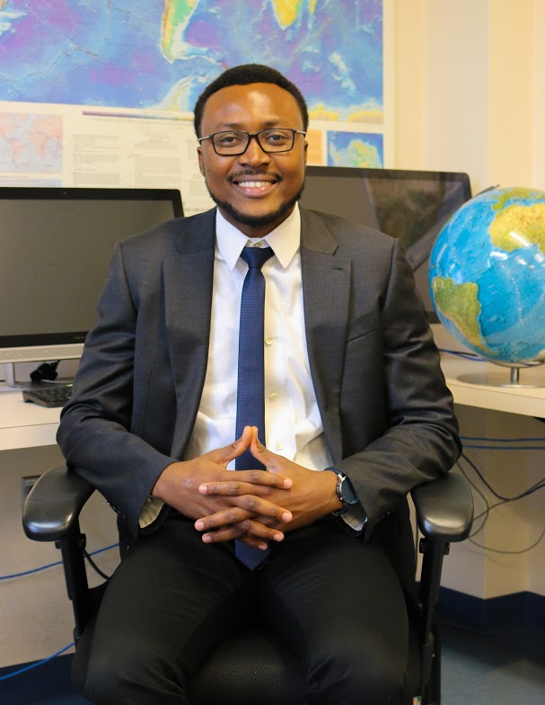 Tolulope Olugboji seated in an office chair.