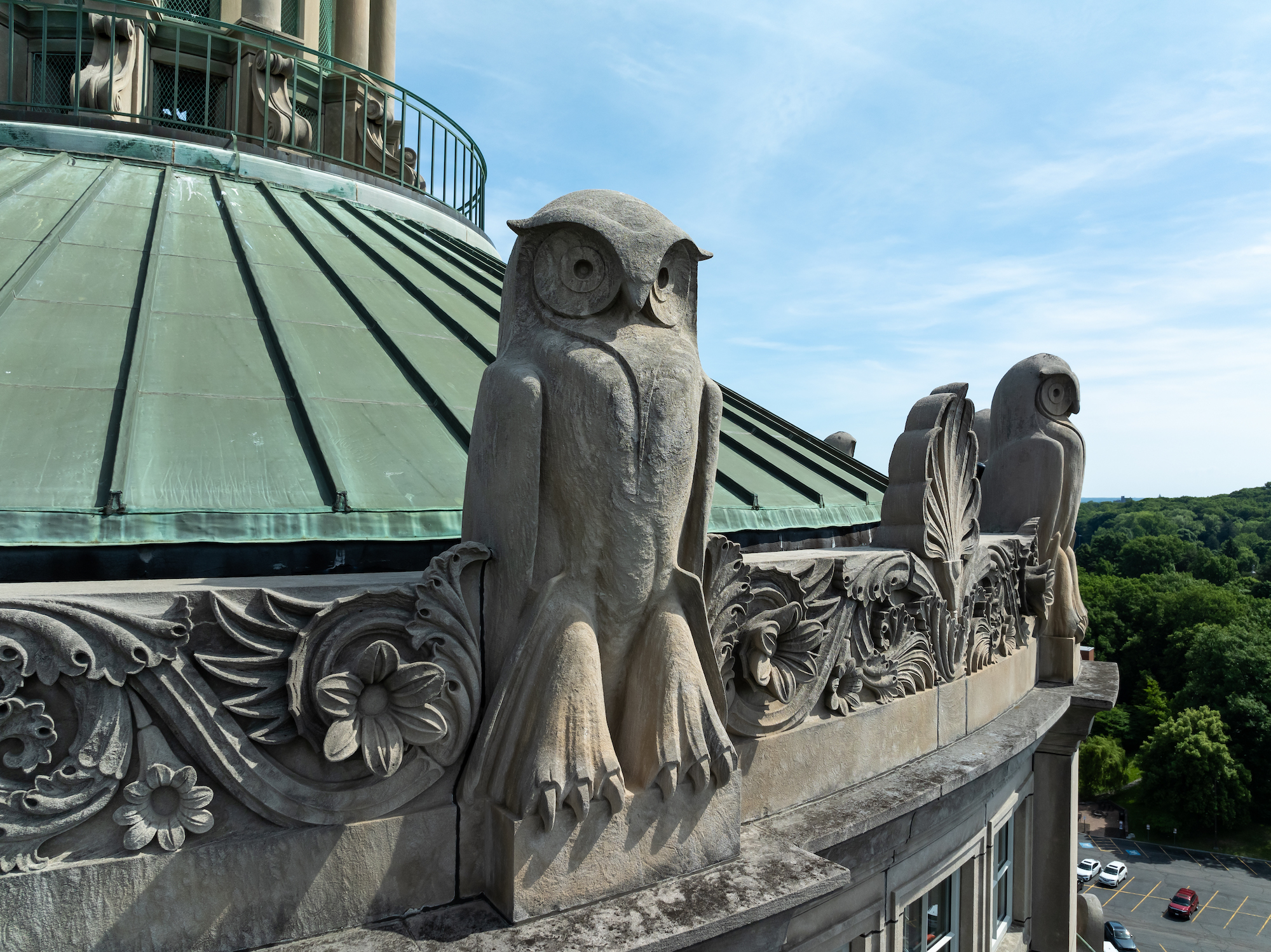 Limestone owls adorning the Rush Rhees Library tower