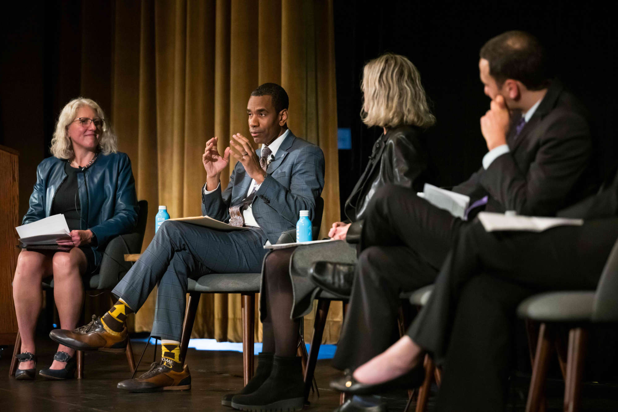 Panelists, including City of Rochester Mayor Malik Evans, seated on stage.