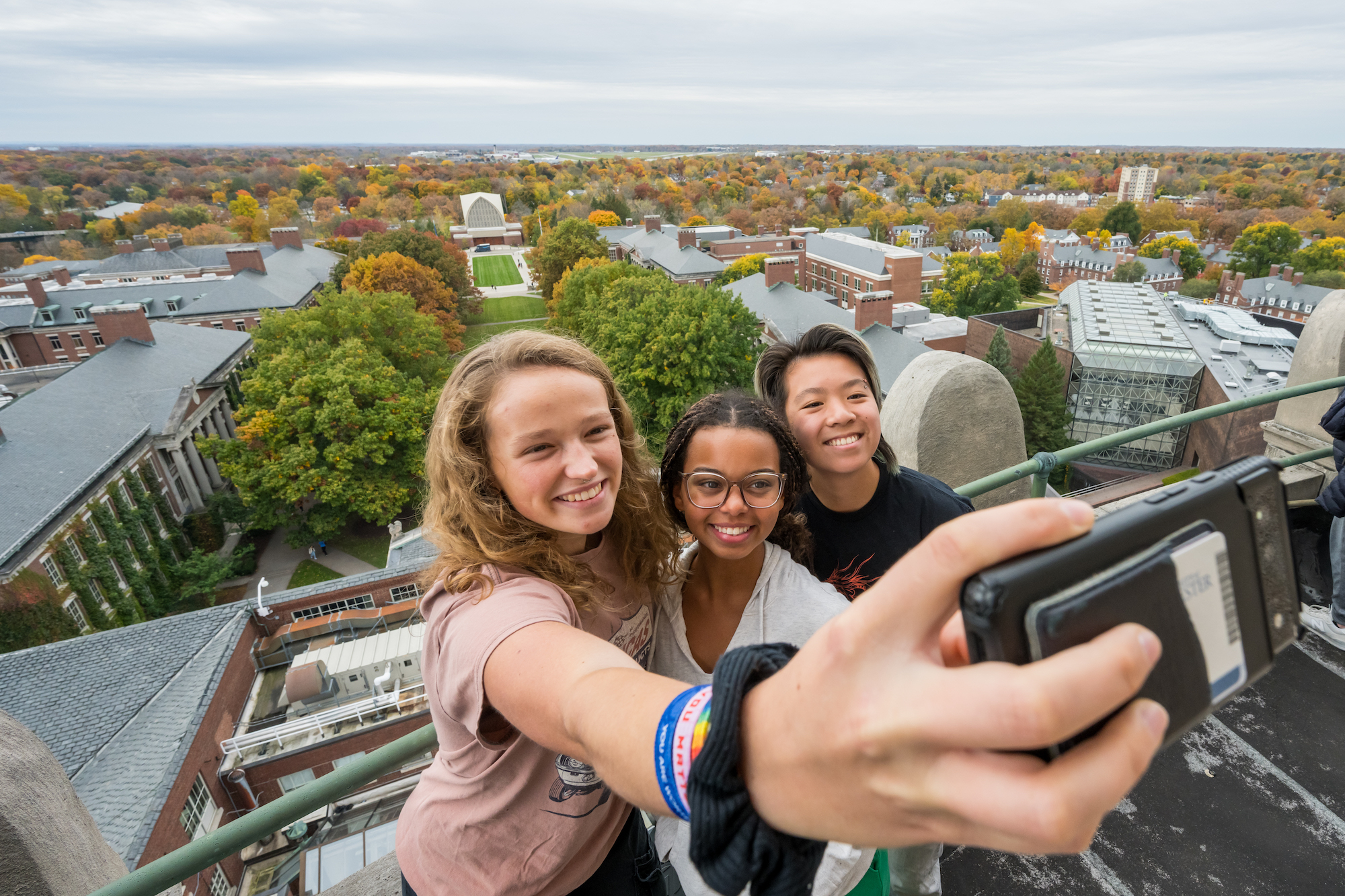 Students take a selfie from atop the Rush Rhees Library tower