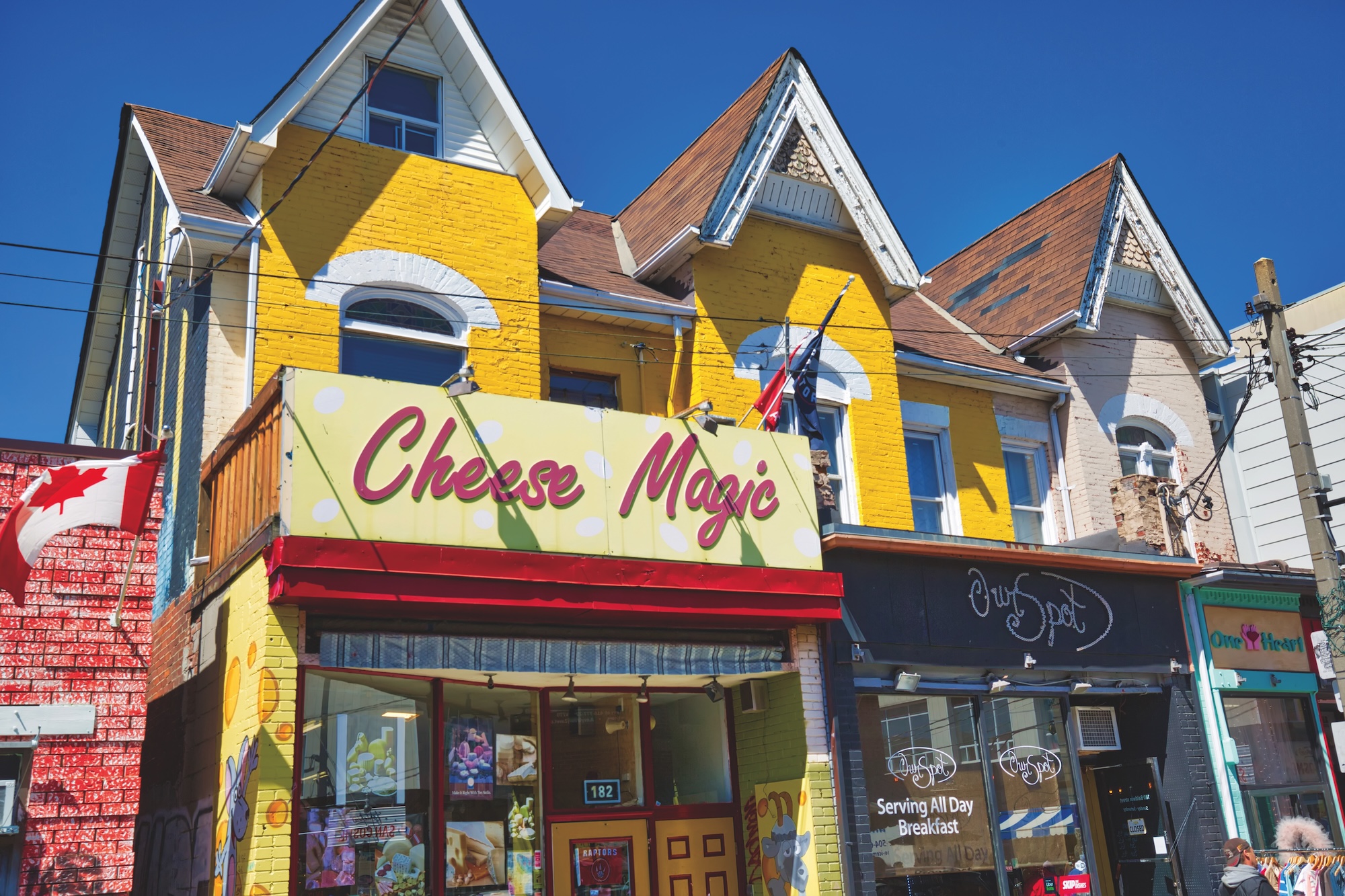 Cheese Magic store against blue sky.