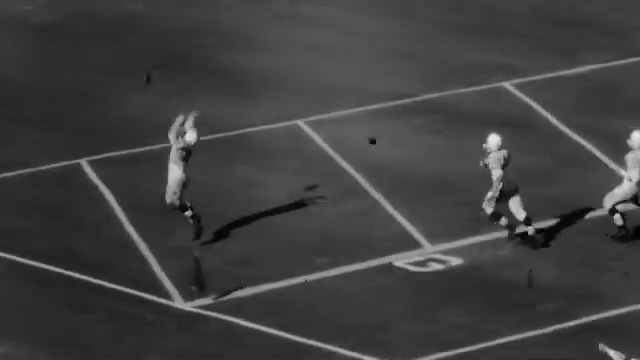 Still of archival footage of a Yellowjackets football game.