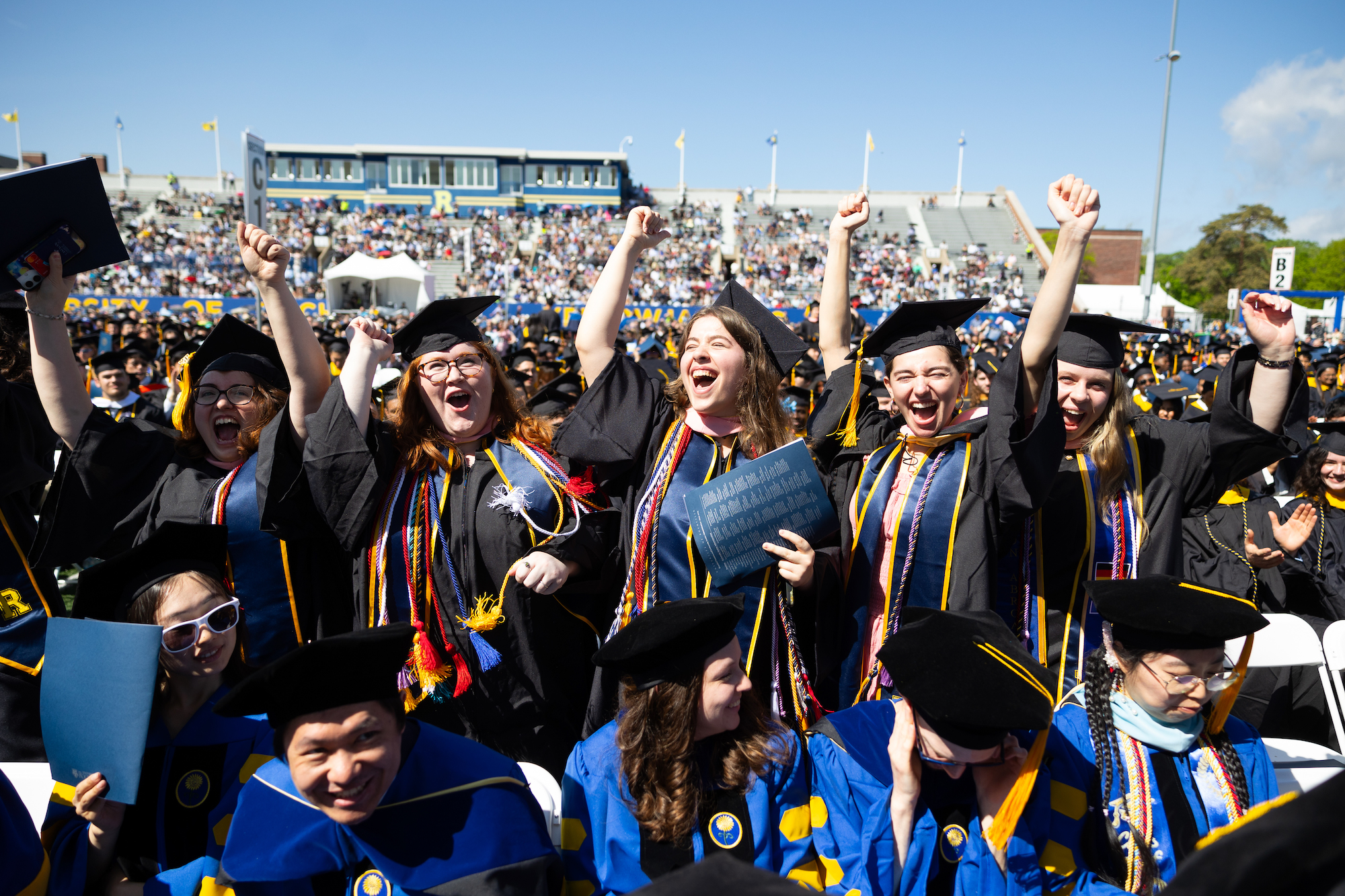 Eastman School of Music graduates celebrate during conferring of degrees. 