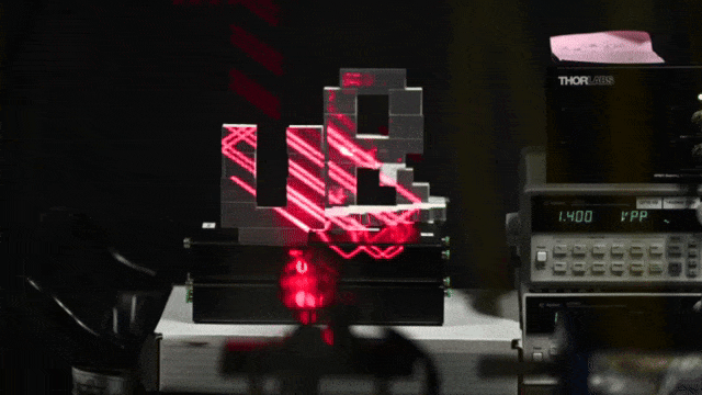 GIF of a chip-scale laser imaging with red light the letters 