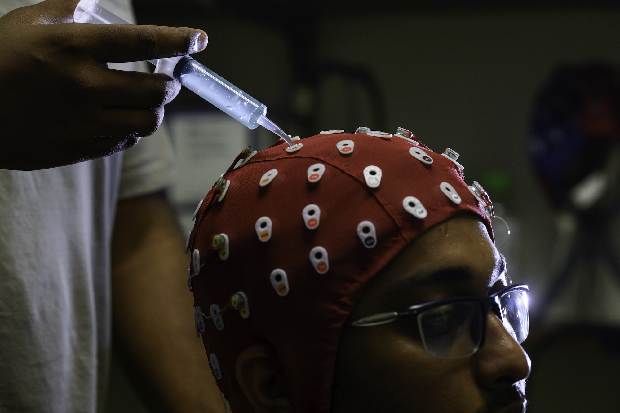 Biomedical engineering PhD student Fazla Mashrur wears an electroencephalography cap during an experiment.