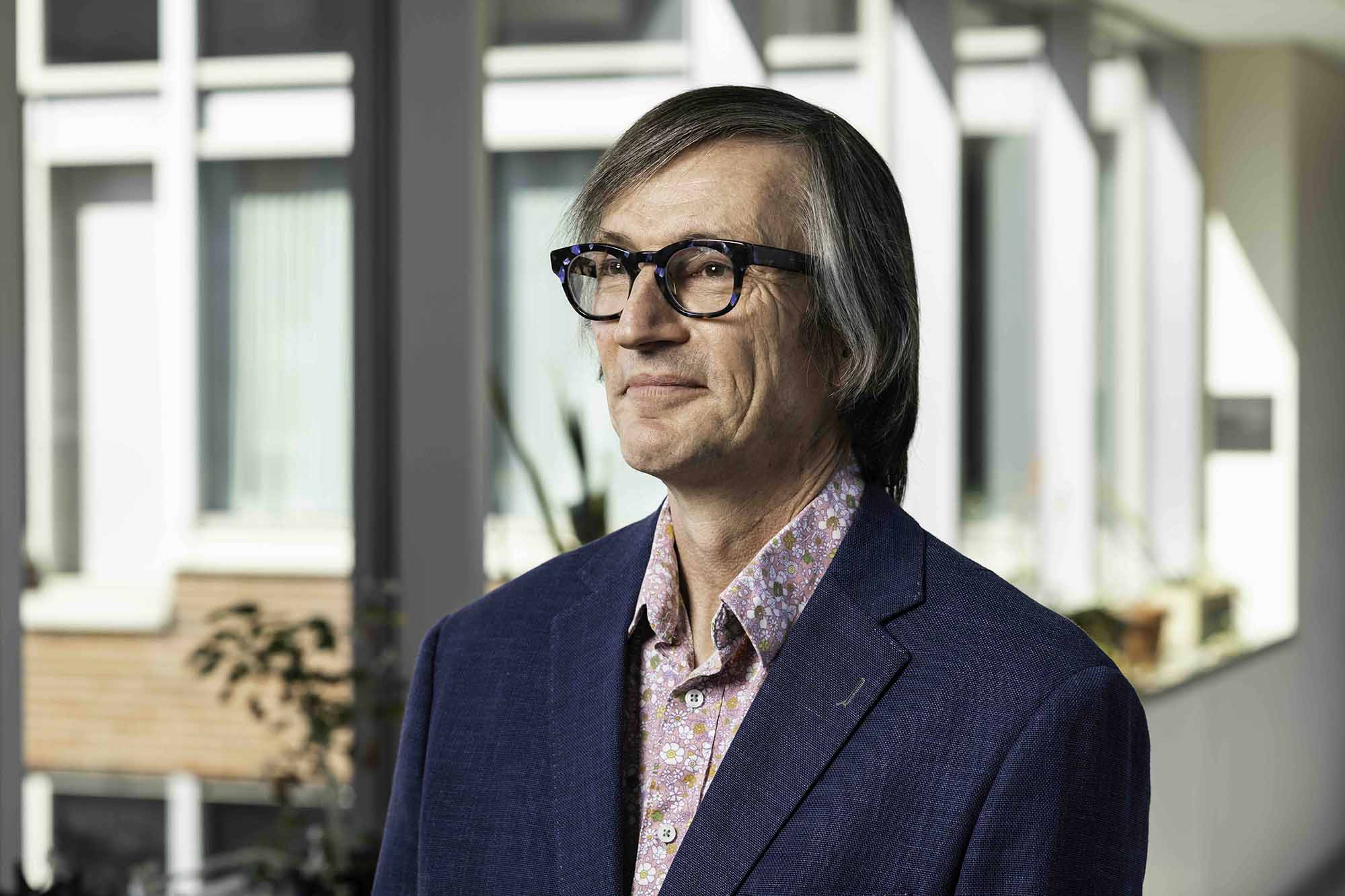 Portrait of Stephen Dewhurst looking off-camera.