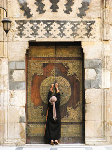 person closing a large door