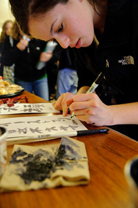 cranes girl writing caligraphy