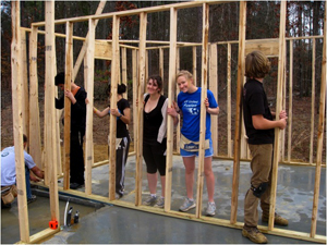 habitat students building house