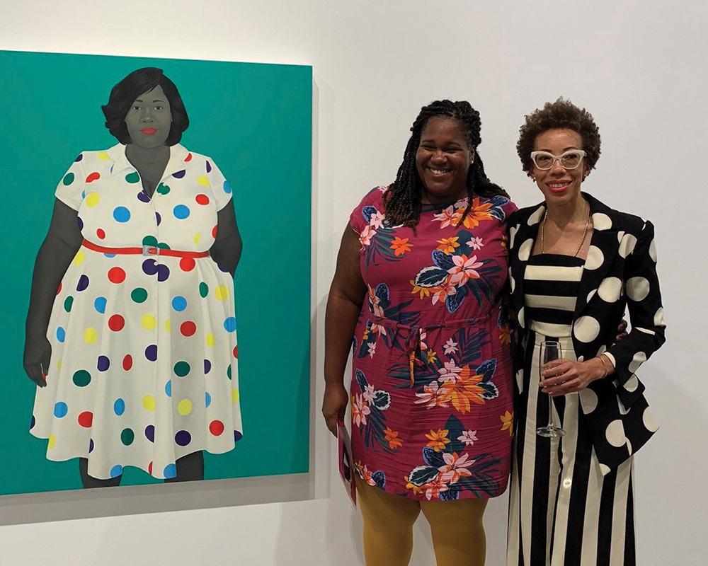 photograph of a portrait with the subject and the artist