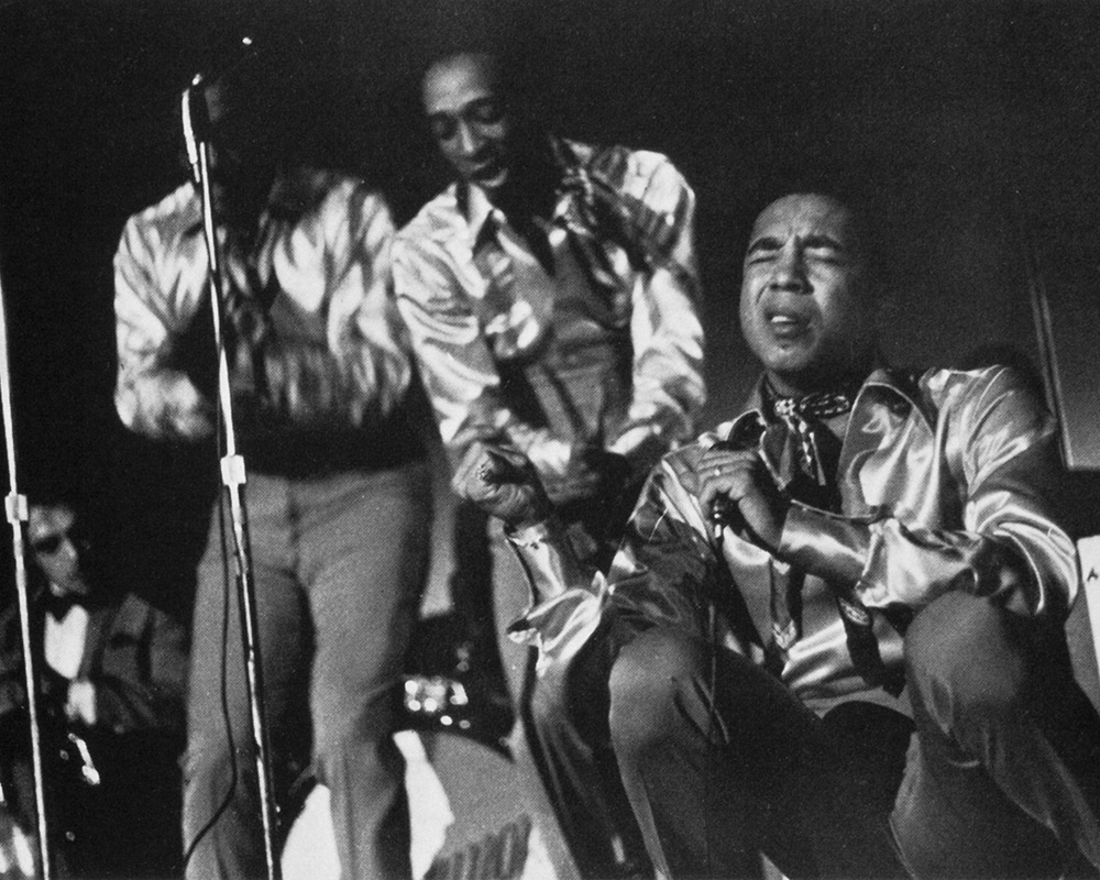 photo of musician Smokey Robinson singing
