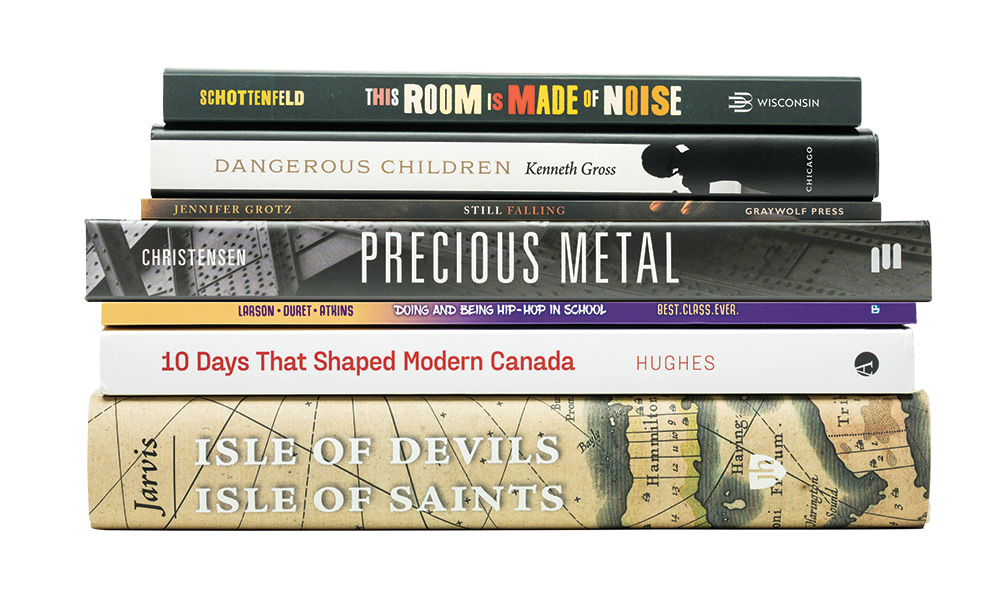 photo of a stack of books written by Rochestser faculty