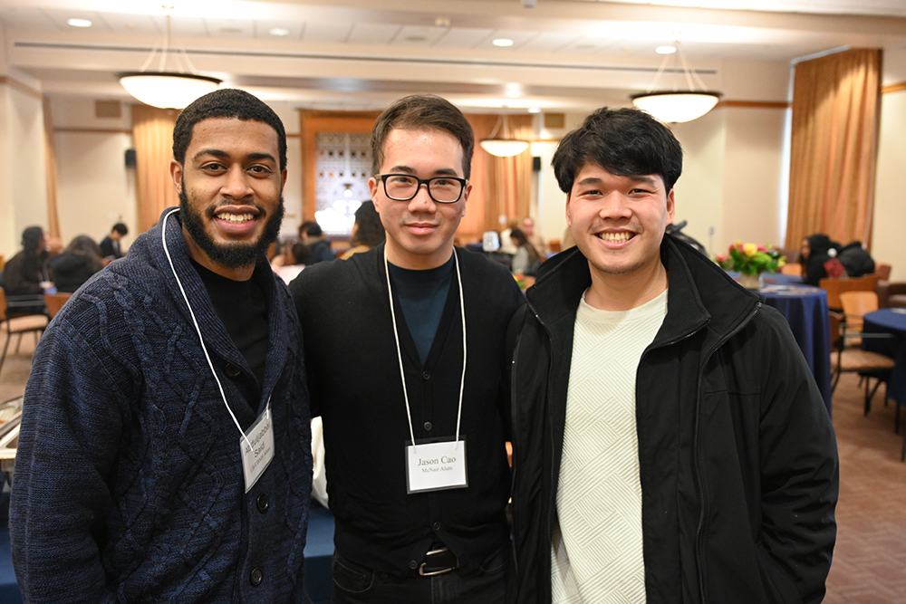 Three people smiling at the camera.