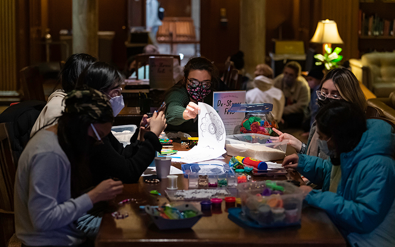 Photo of students working on crafts at a table together