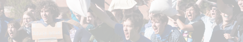 students having pillow fight on the quad