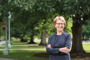 Diane Ambler ’71 standing in quad