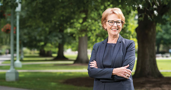 Diane Ambler ’71 standing in quad