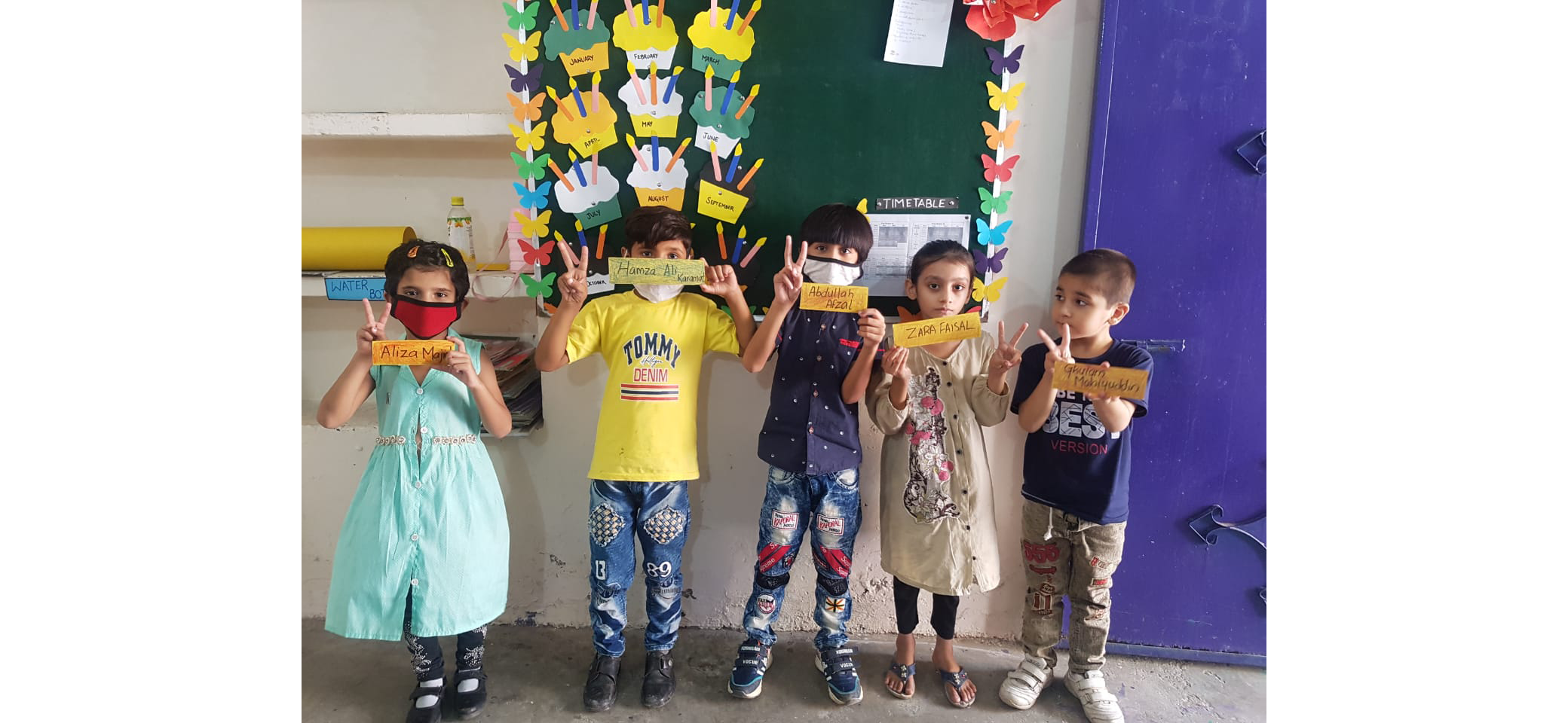 Preschool students writing their own names