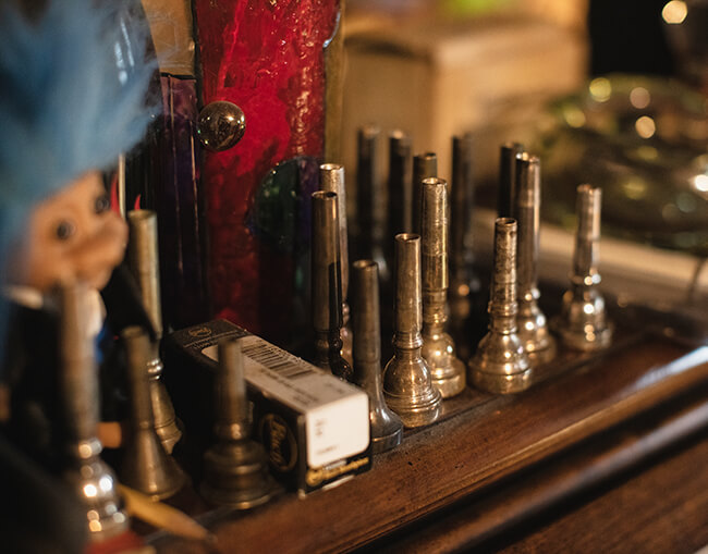 Photo of mouthpieces resting on Smith’s classic rolltop desk