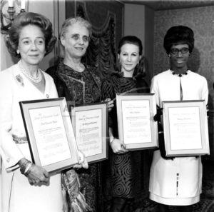 SHARING THE HONORS four women holding awarded certificates from the fifteenth annual spirit of achievement luncheon, april seventeenth, nineteen sixty-nine
