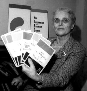 Dr. Mary S. Calderone holding informational pamphlets