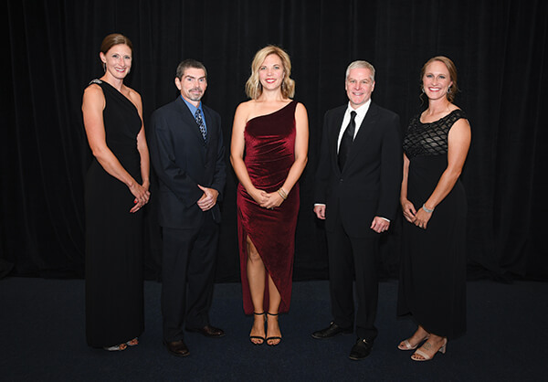 The 2022 Hall of Fame inductees include (left to right) Kelly Wescott Mick ’05, Marcus Gage ’94, ’96M (MS), Leslie Wilmert Donato ’99, Kirk Dietrich ’98, and Aria Garsys Goodberlet ’00.