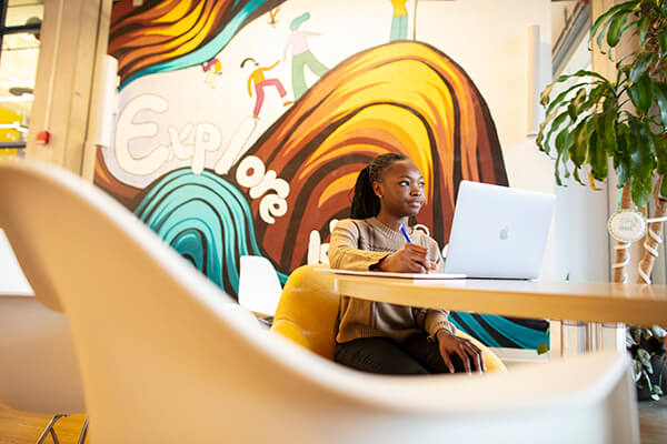 Fredricka Amoah ’26 studies at one of her favorite spots on campus, the Barbara J. Burger iZone in the Rush Rhees Library