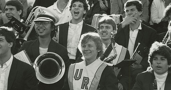 A black and white photo of the Yellowjacket marching band members from the 1980s
