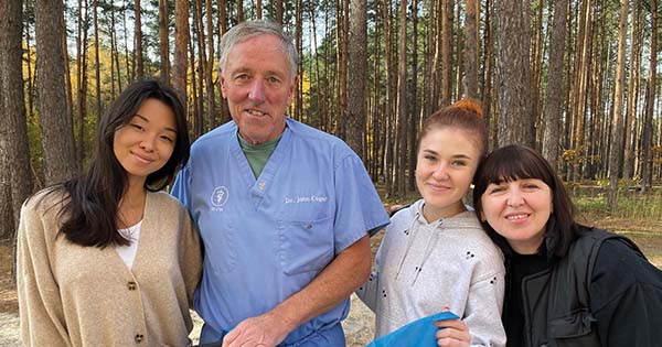 STAFF SUPPORT: The staff of a Ukrainian clinic presented Cogar with a flag to thank him for his service treating abandoned dogs and cats as a volunteer veterinarian near the capital of Kyiv.