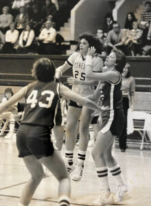 Gretchen Herbert ’84 playing basketball for the University of Rochester