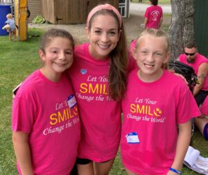 Melisande Ploutz ’13N (MS) with children at camp