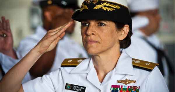 Admiral Gretchen Herbert ’84 saluting in uniform