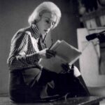 Anne Keefe, seen reading papers