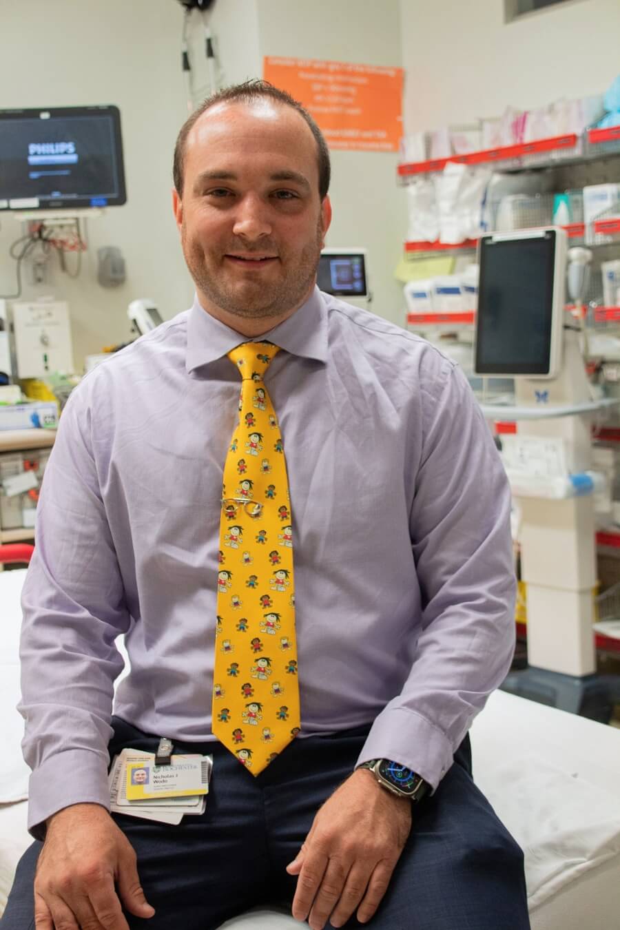 Nicholas Wodo posing for a photo within a medical office 